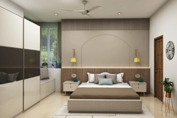 The floor-to-ceiling sliding wardrobe in earthy toned bedroom