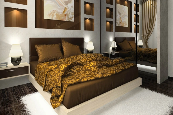 The Luxurious brown motid and the plush  headboard of this Bedroom take elegance to the next level